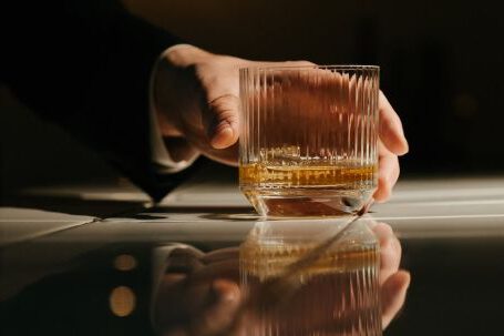 Pro Tips - Person Holding Clear Glass Mug With Brown Liquid