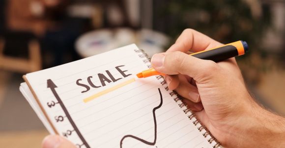 Scale Affiliate Marketing - Person Drawing on a Notebook